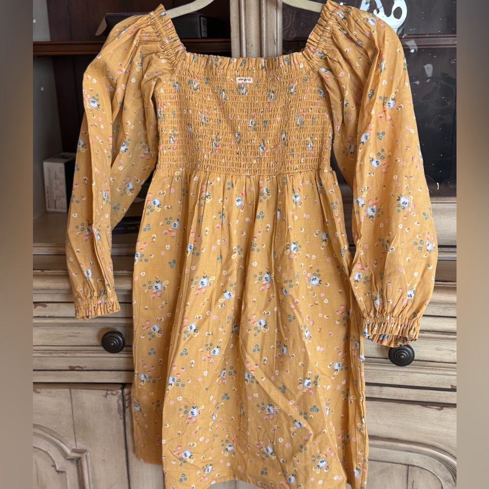 Childrens Wrangler tunic or dress. The print is a variety of delicate flowers.